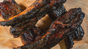 Cluck & Squeal Canadian Pork Belly Ribs with Rib Formula and Tasty Hot - Cluck & Squeal Seasonings and BBQ Rubs.